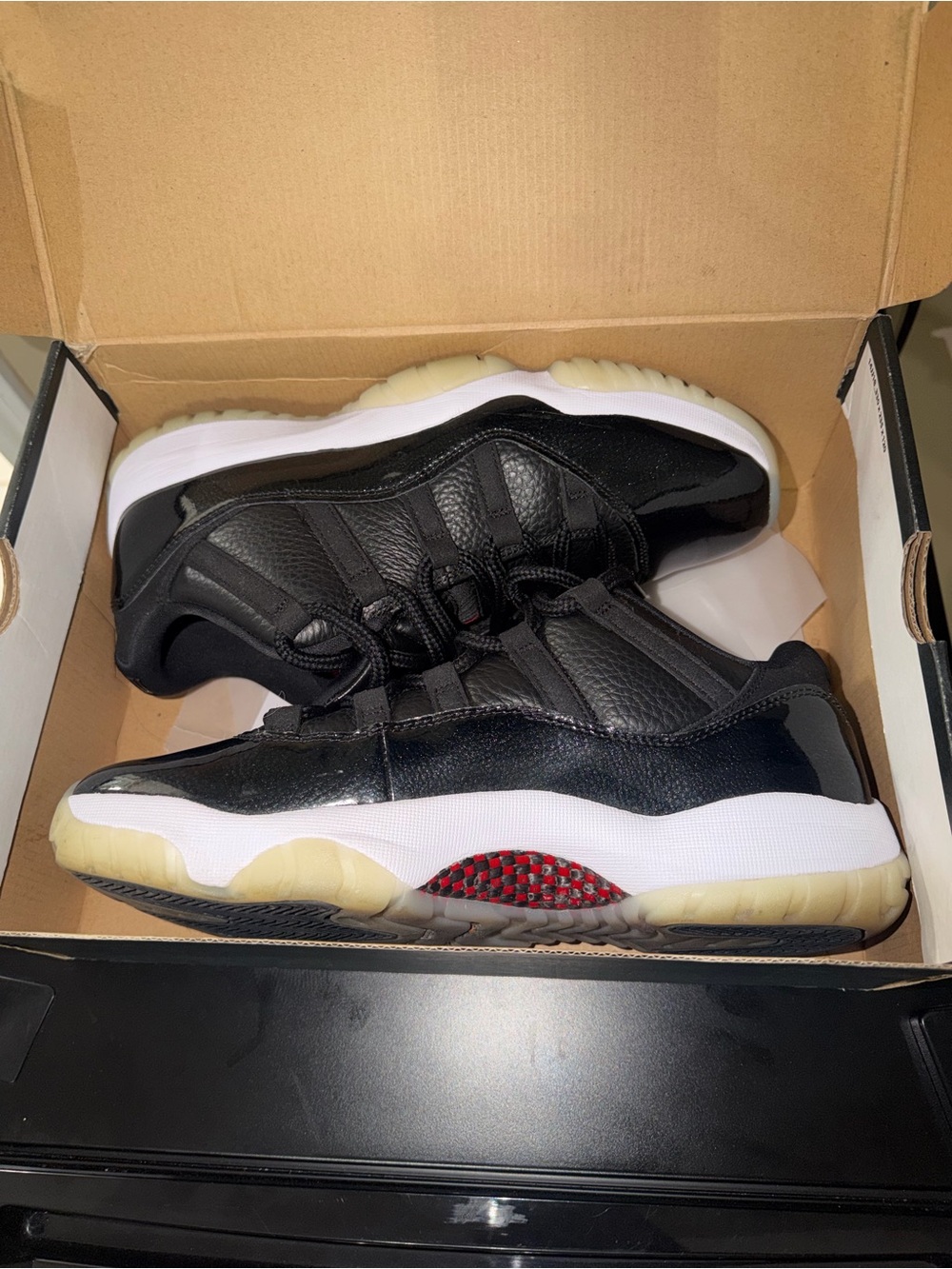 Jordan Men's Black and White Low-Top Sneakers with Red Accents
